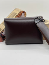 Load image into Gallery viewer, Brown leather pouch with a strap on a light gray background