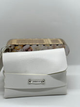 Load image into Gallery viewer, White handbag with a visible brand logo on a light gray background
