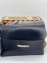 Load image into Gallery viewer, Black leather clutch bag with a visible brand logo on a white background