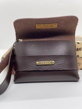Load image into Gallery viewer, Brown leather clutch bag with a strap on a white background
