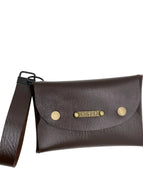 Brown leather clutch with gold accents on a white background