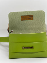 Load image into Gallery viewer, Green handbag with a textured green flap and visible brand name on a white background
