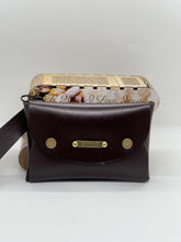 Load image into Gallery viewer, Brown leather bag with gold accents on a white background
