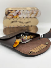 Load image into Gallery viewer, Brown leather pouch with gold tag on a white background
