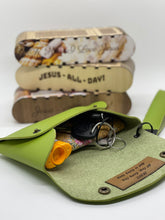 Load image into Gallery viewer, Green keychain pouch with keys and a small bottle, stacked Swiss Army knives in the background.
